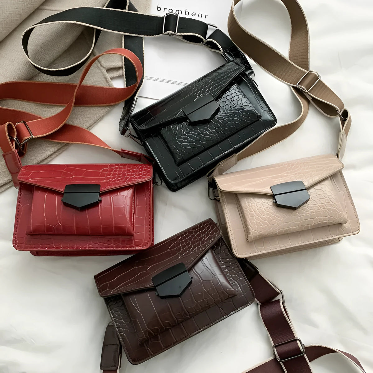 Vintage-style crossbody bag in PU leather shown in black, dark brown, khaki, or red