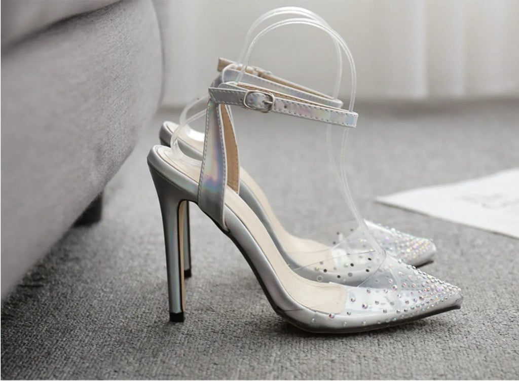 Women's pointed toe stiletto sandals with diamond ornamentation on a PVC upper.