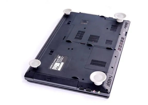 Grey plastic laptop cooling pad set showing two larger and two smaller pads for temperature reduction