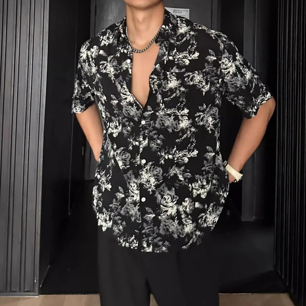 Man's loose-fit short sleeve shirt with printed floral pattern and pendant detail in black