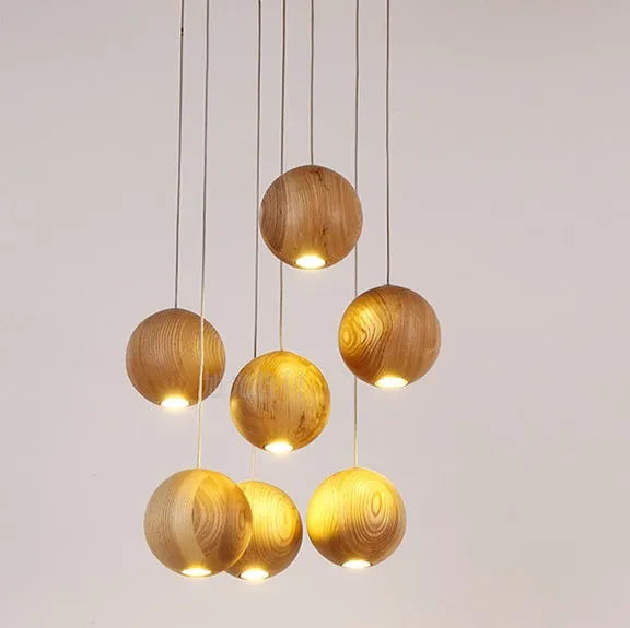 Nordic style wood ball chandelier with adjustable hanging height and solid wood construction for living room