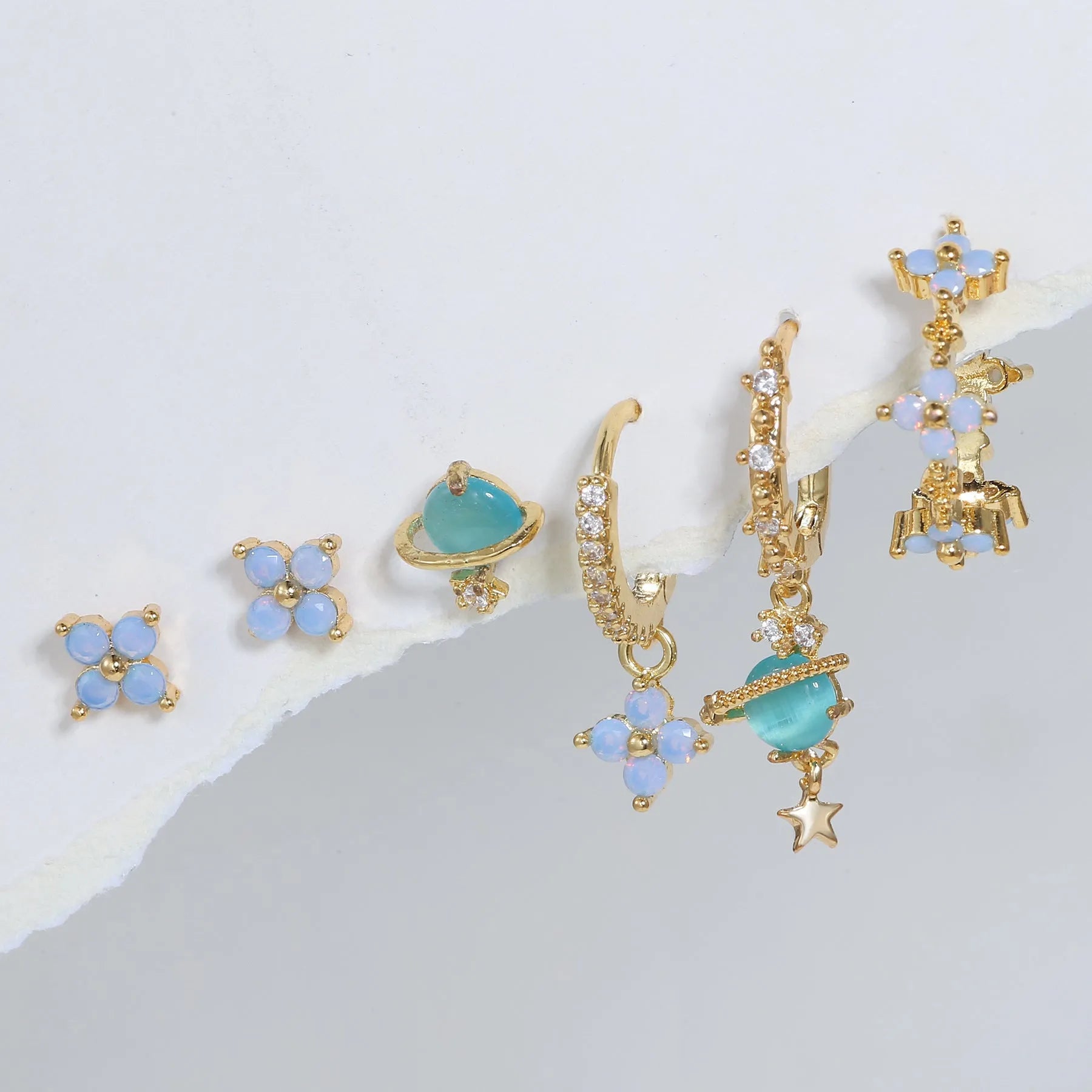 Flower-shaped ear studs with protein nail and zircon mosaic details in gold or silver Japanese Korean style