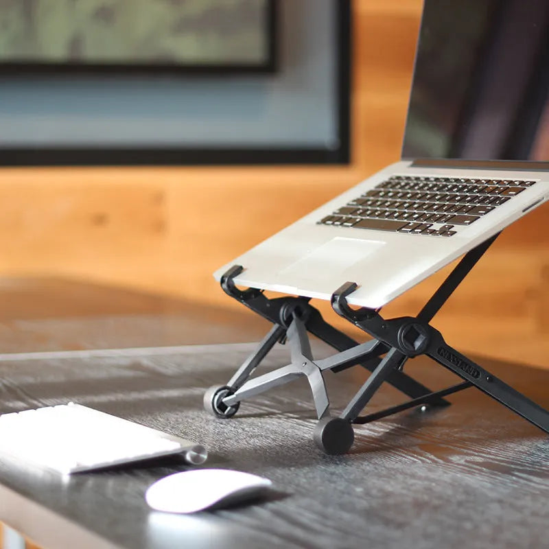 Black folding portable laptop stand showing folded dimensions of 35.4cm wide