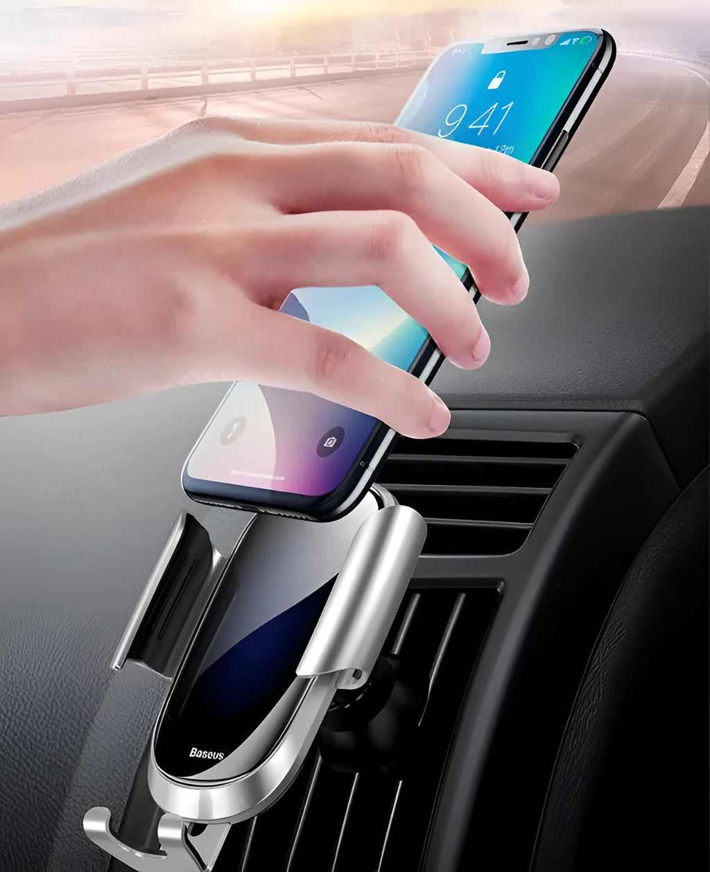 Universal smart car bracket with adjustable silicone arms, mounted on a car air vent holding a mobile phone.