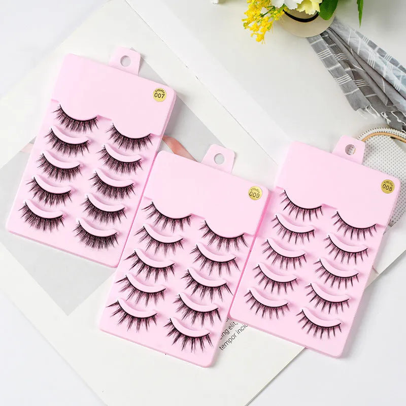 Pack of 15 pairs of natural wispy manga false eyelashes on black plastic bands for cosplay.