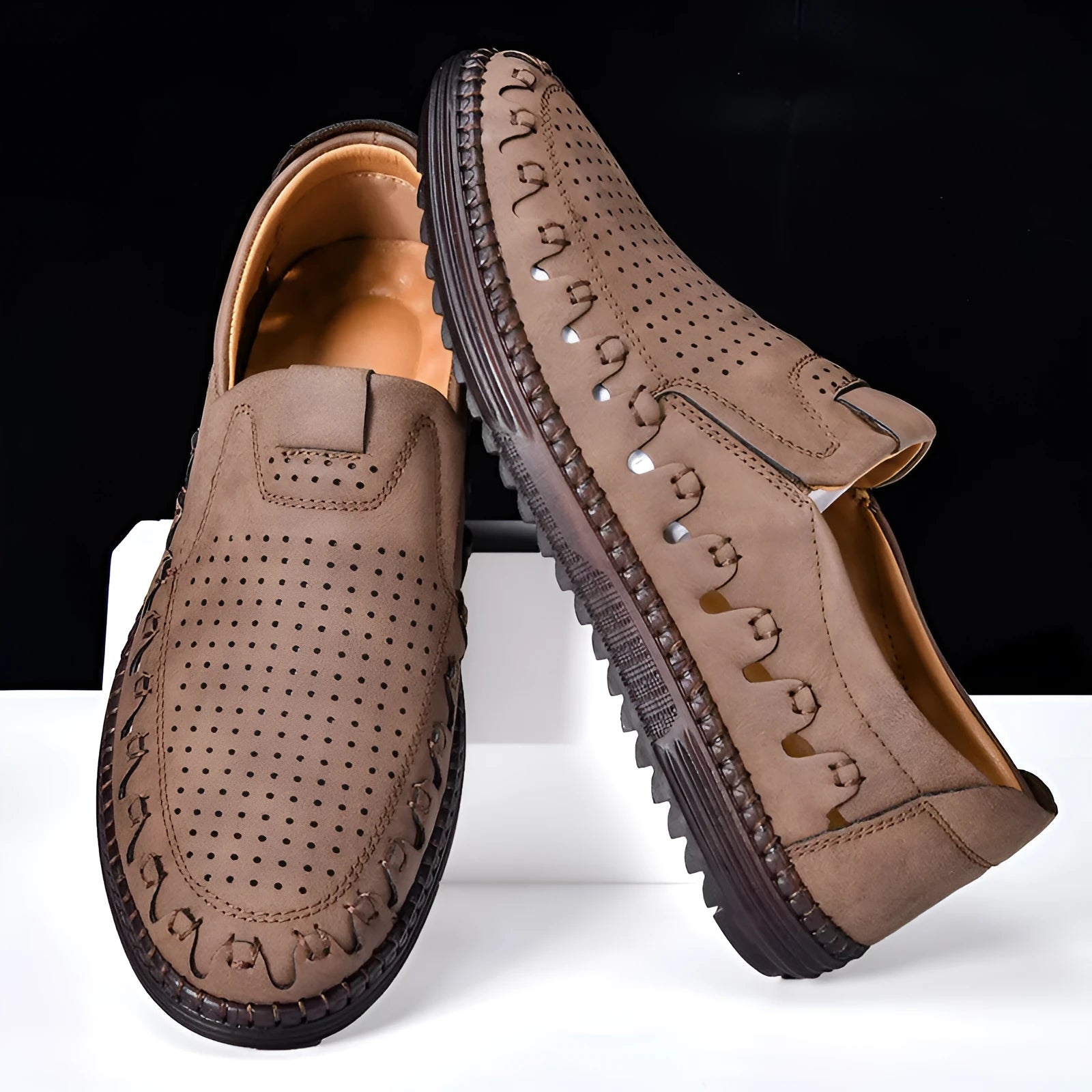 Men's brown slip-on casual shoes with a round toe and flat heel