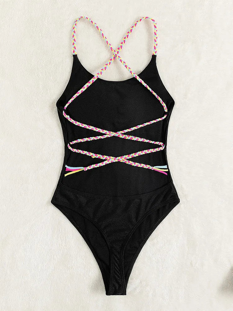 Black solid colour backless one-piece swimsuit on mannequin showing sleeveless design