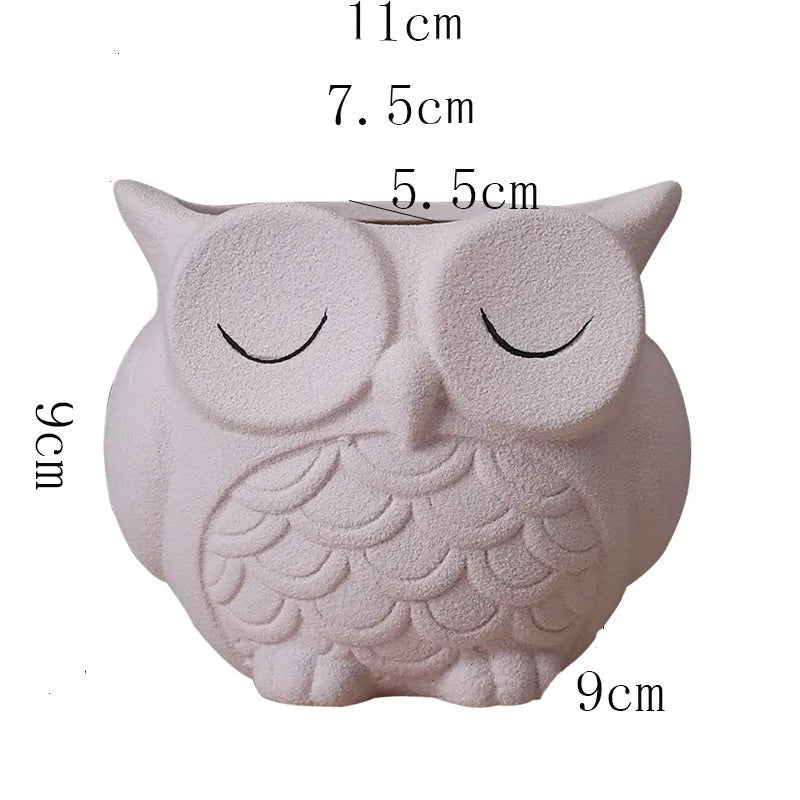 Handmade ceramic owl-design succulent pot in frosted light pink, white, green, or blue, measuring 11cm by 9cm.