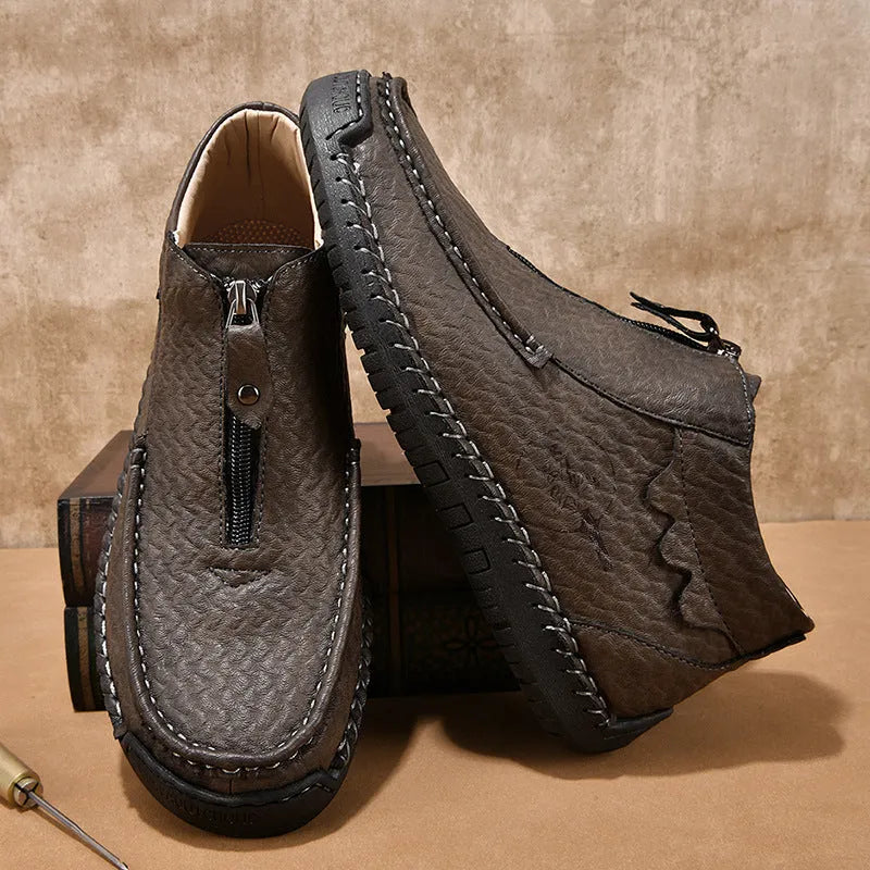 Men's black slip-on casual loafers with round toe and rubber sole.