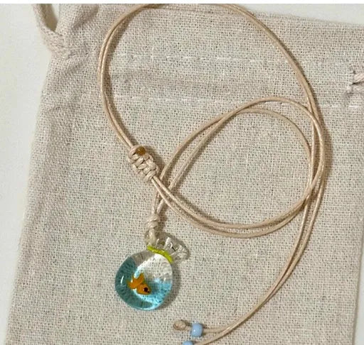 Women's joker design pendant necklace with coloured glaze charm on a cotton and linen clavicle chain.