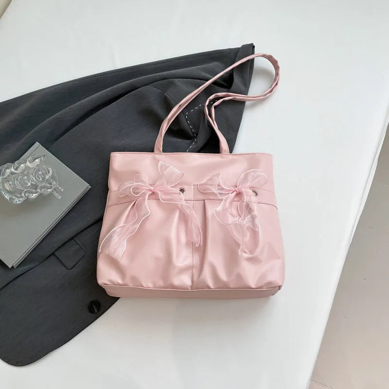Black college style bow tote bag with large capacity and zipped internal compartments