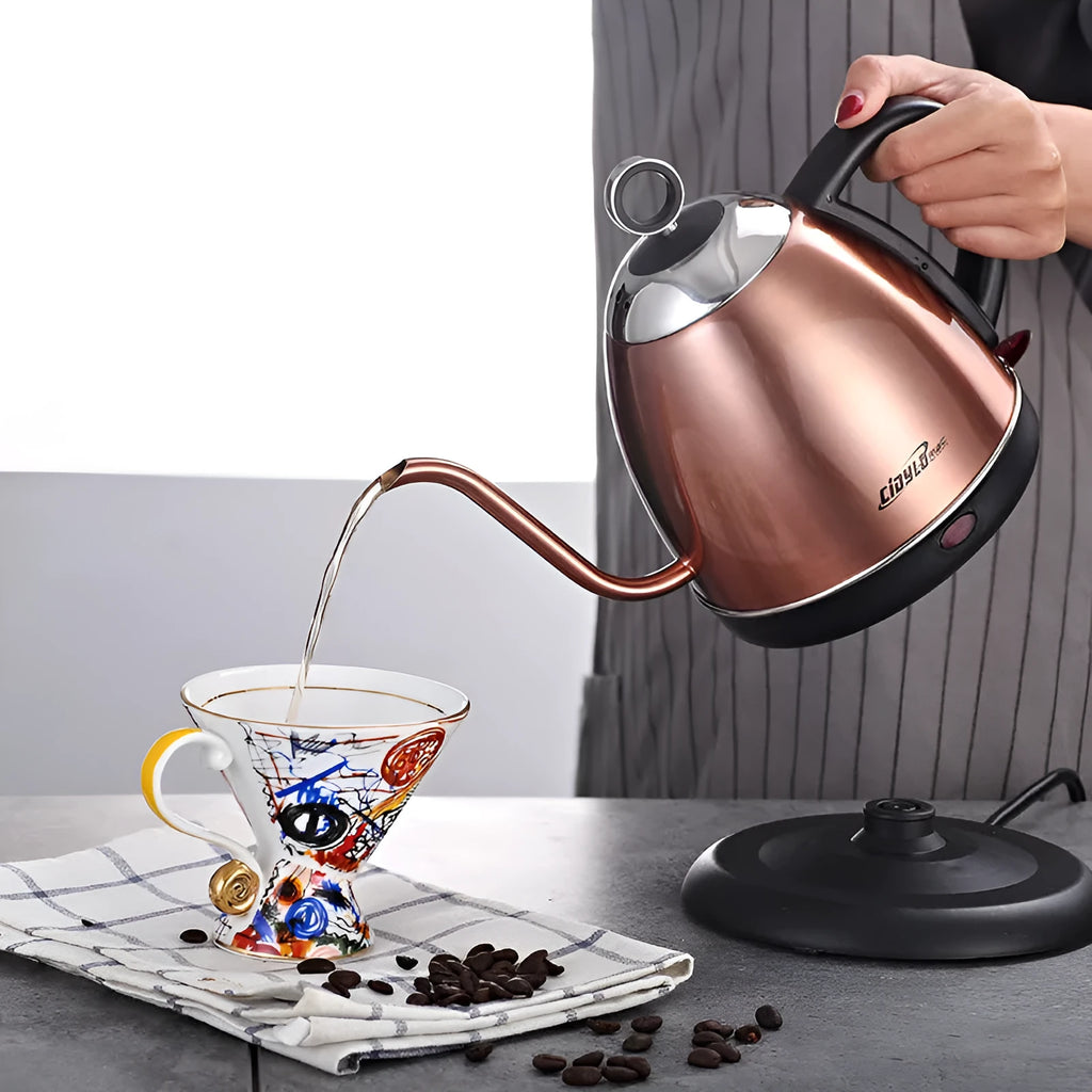 Gold full-automatic stainless steel kettle with touch control panel on a kitchen counter.