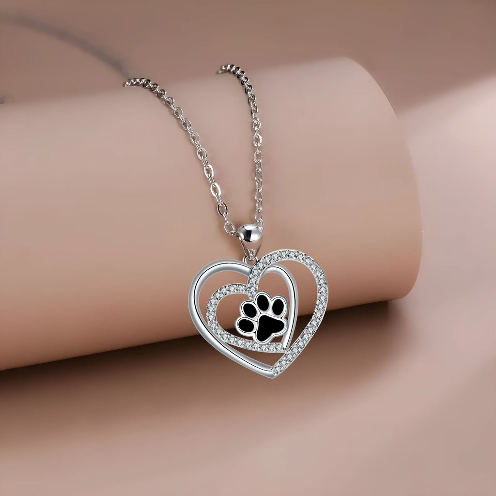Women's dog paw footprint necklace with heart design on copper pendant and cross chain