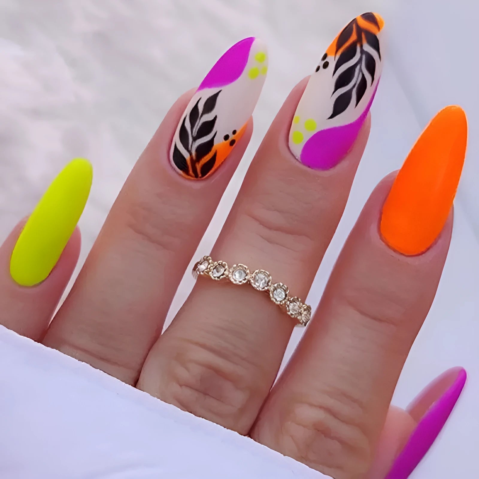 Four boxes of medium almond shaped frosted nail stickers with colourful tulip patterns including French leaves and leopard print designs