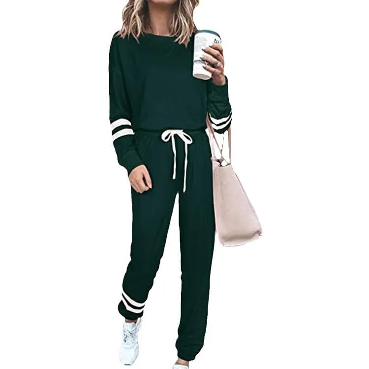 Women's plus size loose-fitting casual suit set in a solid colour, showing the long-sleeve top and matching trousers.