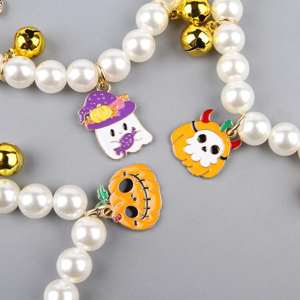 Halloween pet collar decoration with simulated pearl beads and a pumpkin charm.