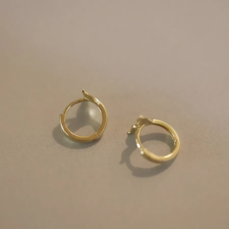 S925 Sterling Silver fishtail drop earrings in gold and white gold tone finishes.