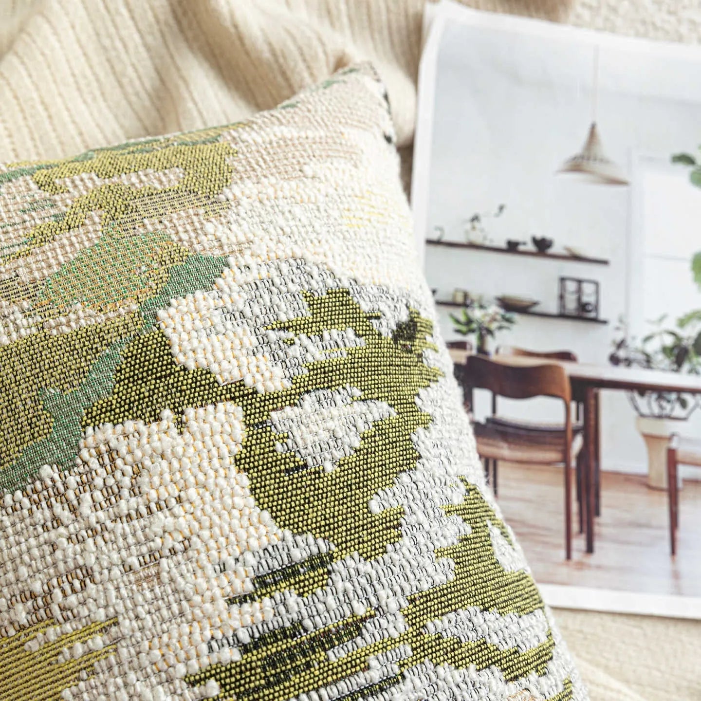 Antique green wool blend decorative pillow with abstract floral pattern, shown in lumbar and square sizes.