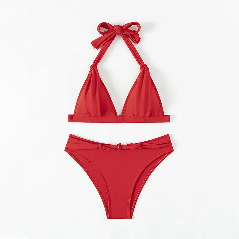 Red women's bikini with lace-up halterneck top and split shorts