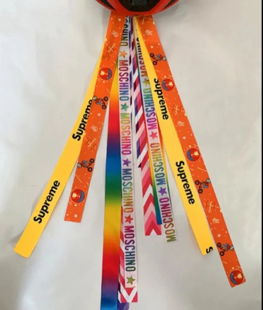 Decorative ribbon streamer for a child's ski or skating helmet in various colour options.