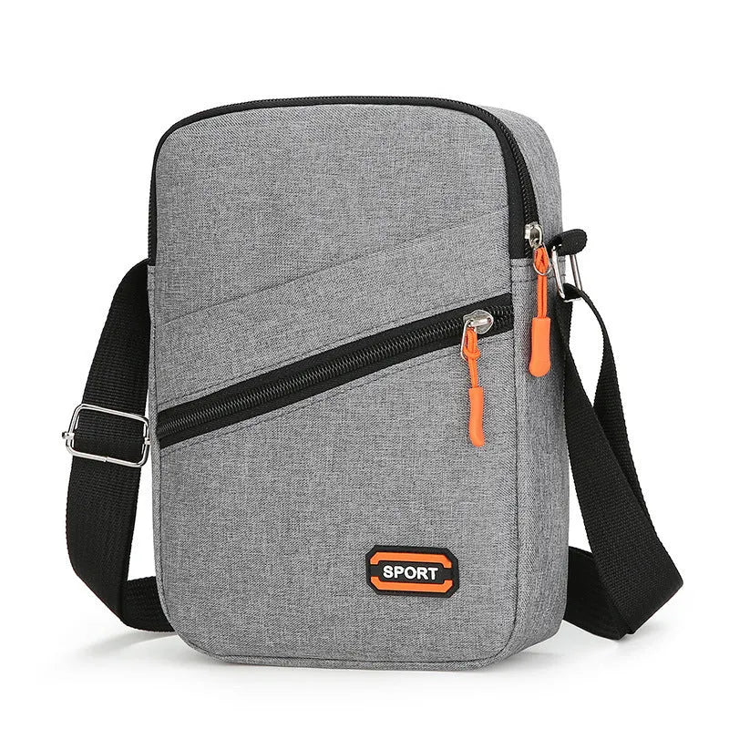 Solid colour Oxford cloth crossbody commuter bag with contrast details in silver grey.