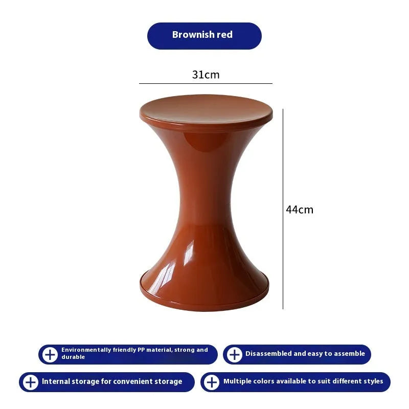 A plastic hourglass-shaped shoe changing stool in a choice of colours.