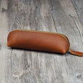 Handmade genuine cowhide leather pencil case in square design with zipper, showing brown colour option