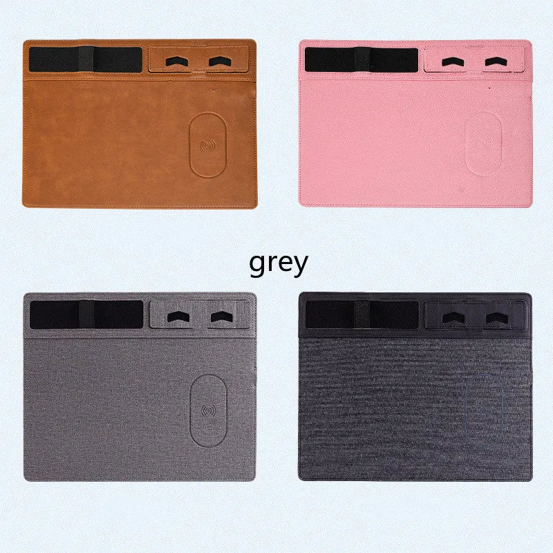 Pink wireless charging mouse pad with phone holder on a desk, showing 320mm by 260mm size and USB cable.