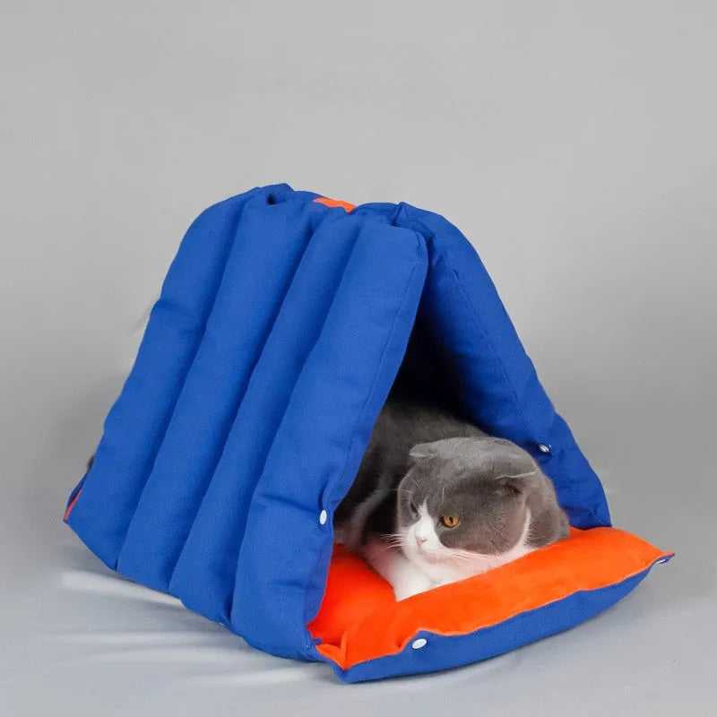 Blue triangular cat bed with drilled holes for modular combination and removable cotton cover