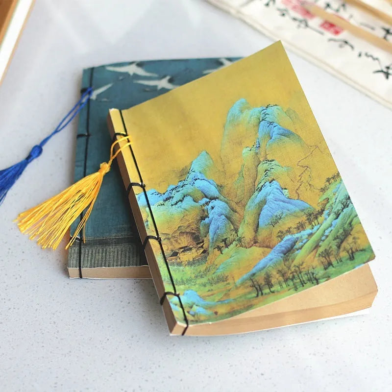 A5 antique wire-bound notebook with retro painting cover, thread binding, and black tassels.