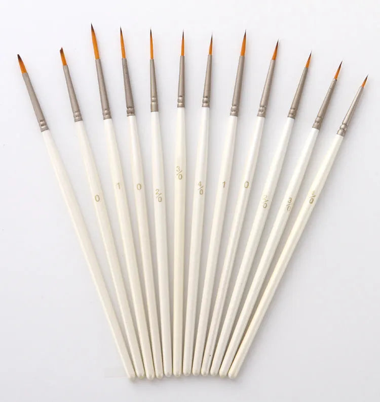 Set of twelve pearl white fluorescent marker pens with nylon wool brush tips for artists.