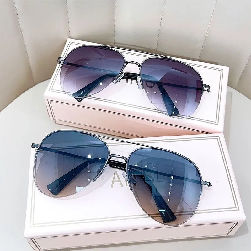Metal aviator sunglasses with UV protection resin lenses in various colour options.