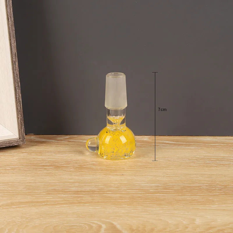 A 7cm transparent coloured glass trumpet-shaped tobacco pipe on a plain background.