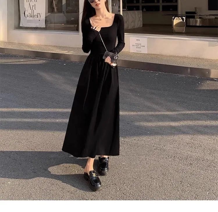 Women's black square collar knitted dress with long sleeves and an A-line skirt.