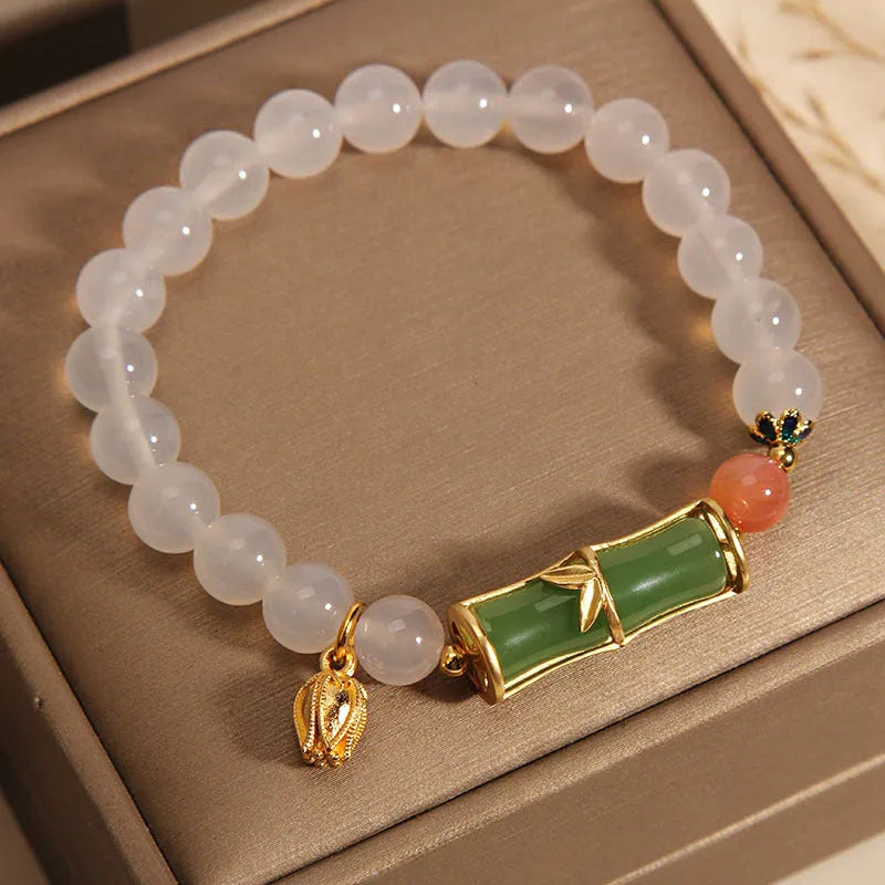 Women's white agate jade bracelet with bamboo joint beads in a retro Chinese style.