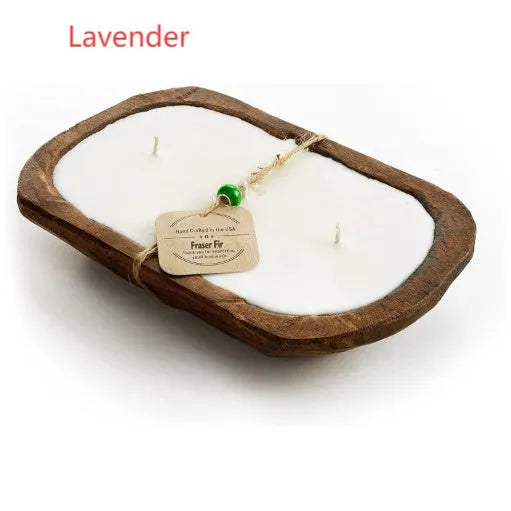 Lavender-scented soy wax aromatherapy candle in a light wooden basin.