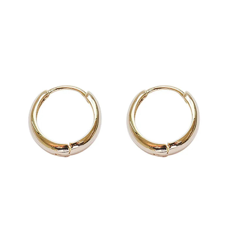 Women's geometric water drop earrings with round elements in electroplated gold or silver finish on copper
