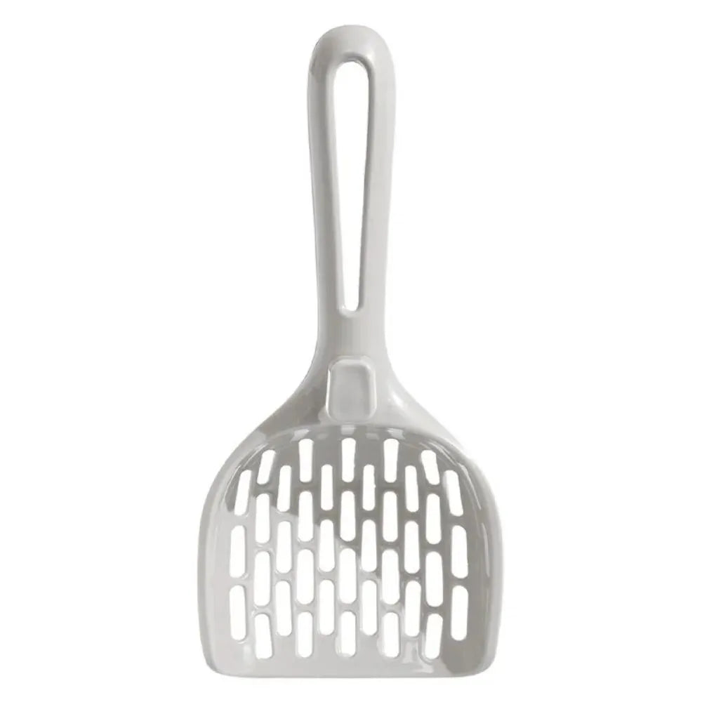 Grey plastic cat litter scoop resting on its matching comb-style base holder.