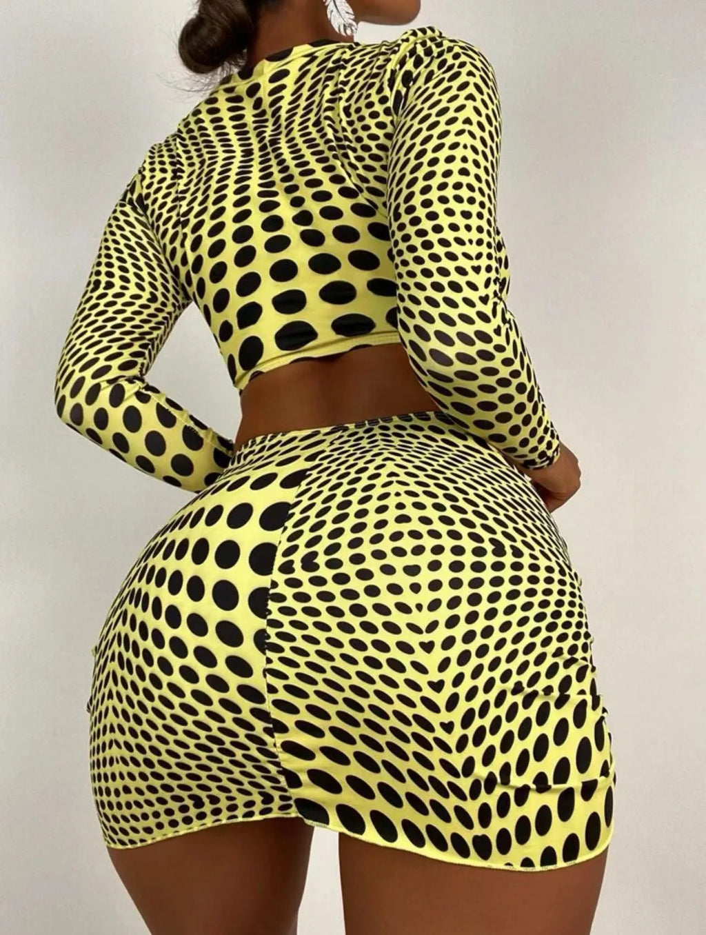Women's green and yellow polka dot polyester swimsuit three-piece set showing top, skirt, and bra.