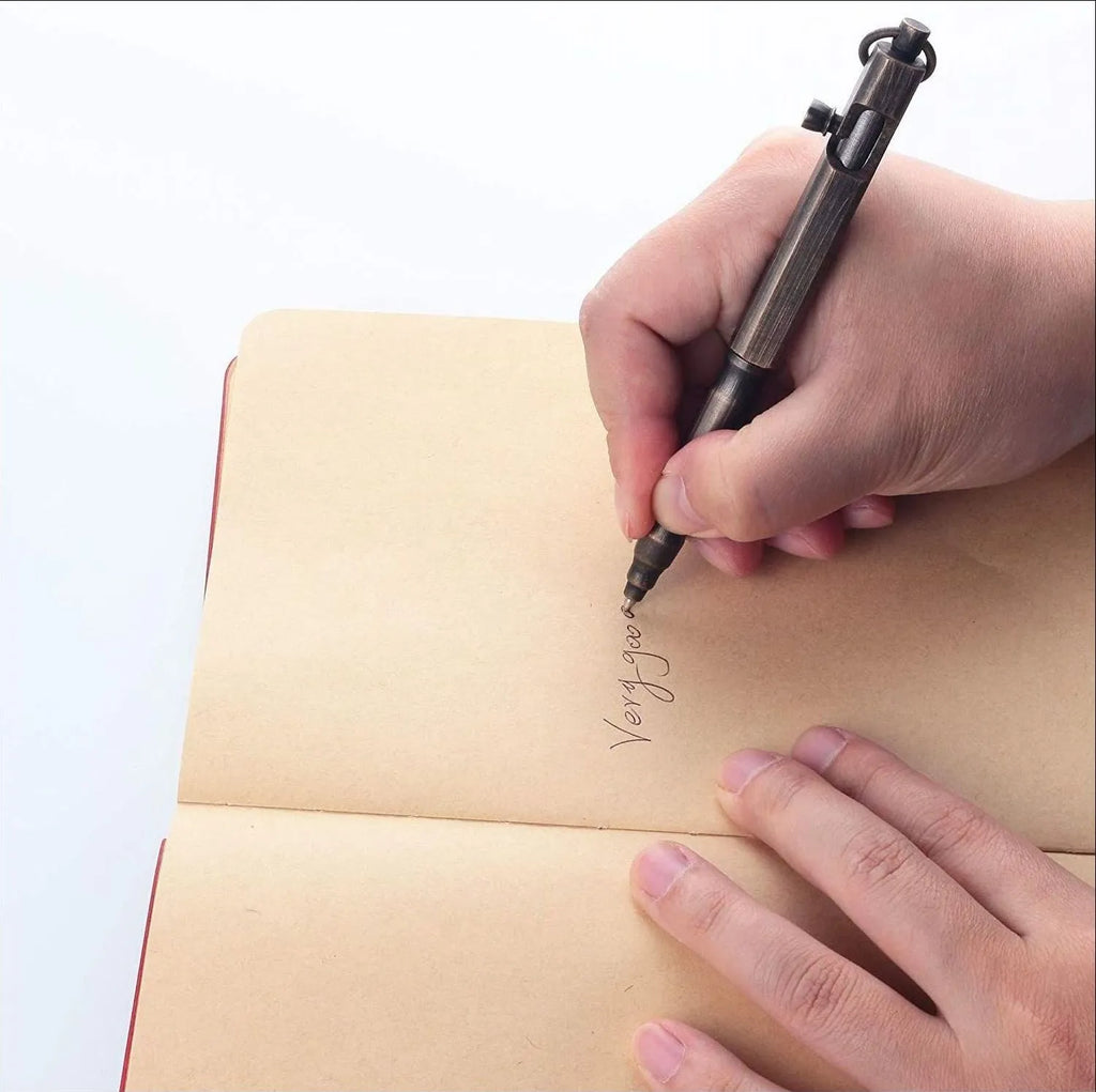 Brass tactical pen with hexagonal bolt design showing natural colour finish and precise machining details
