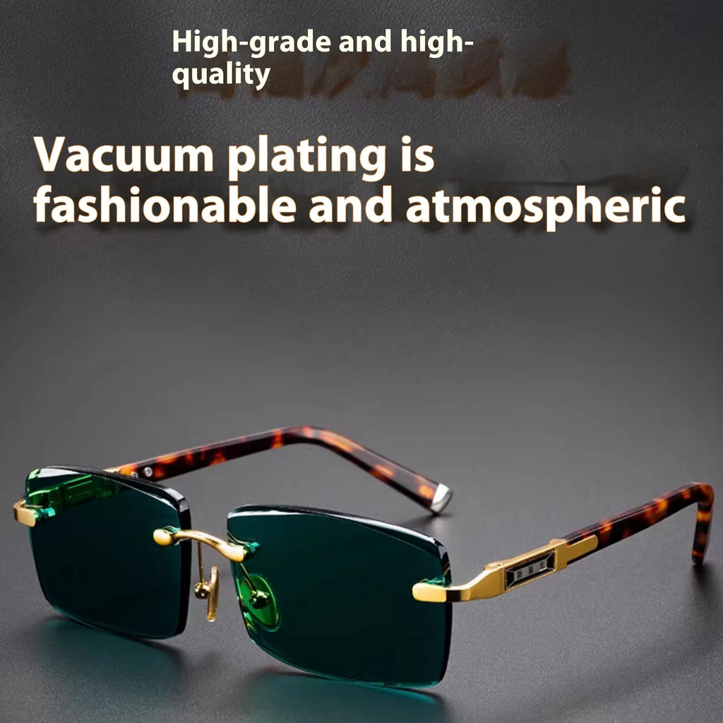 A pair of frameless sunglasses with dark green crystal lenses, shown with a soft case and cleaning cloth.
