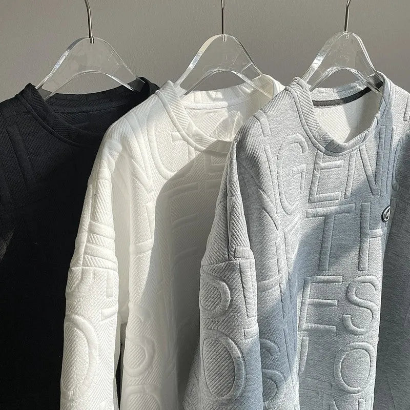 Grey men's loose fit t-shirt with a retro-style three-dimensional raised letter print on the front.