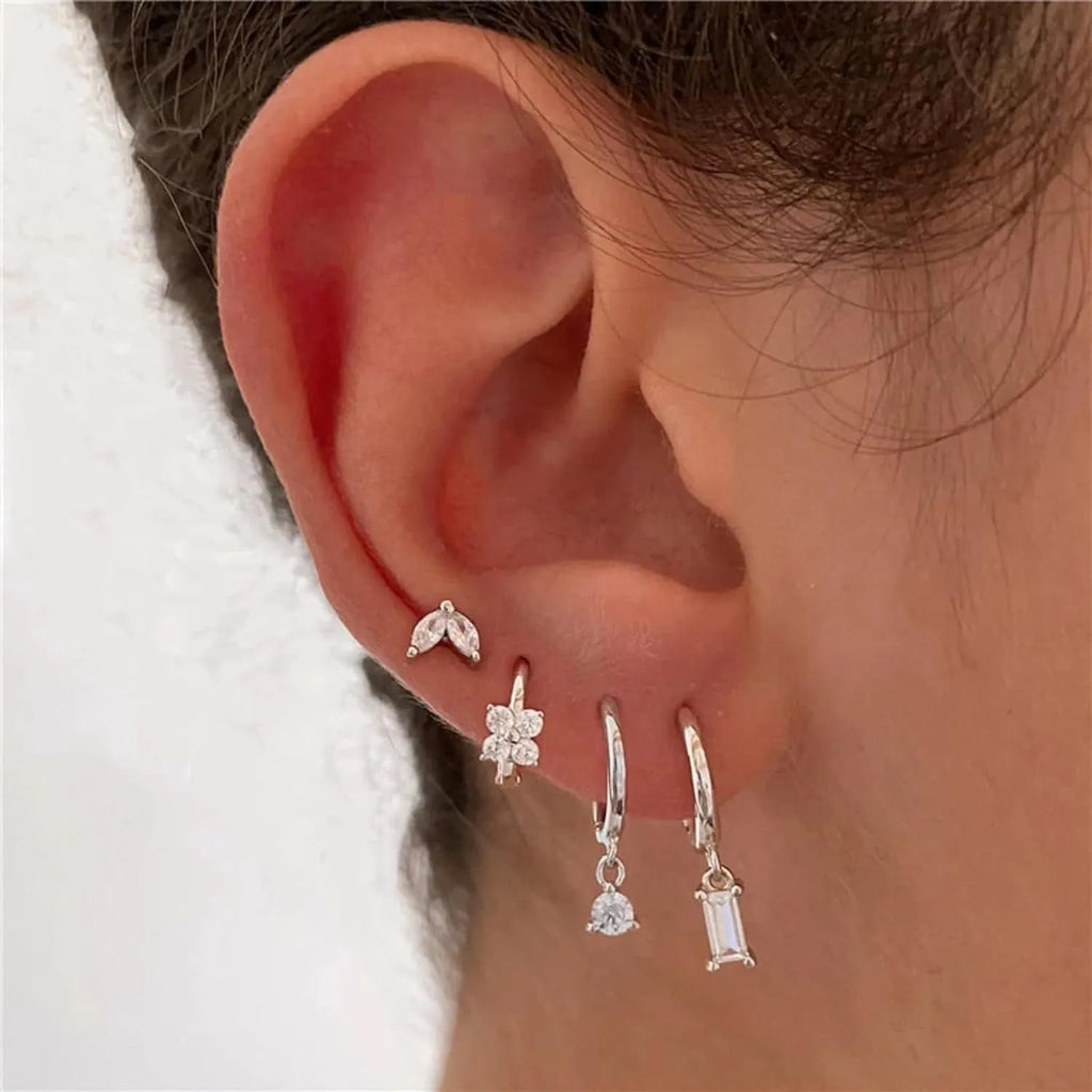 Geometric copper earrings set with zircon stones in gold or silver electroplating, showing star and square designs