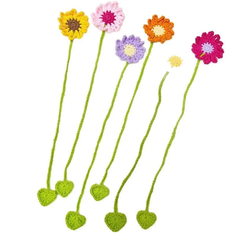 Hand-crocheted wool bookmark with daisy motif on flexible wire core