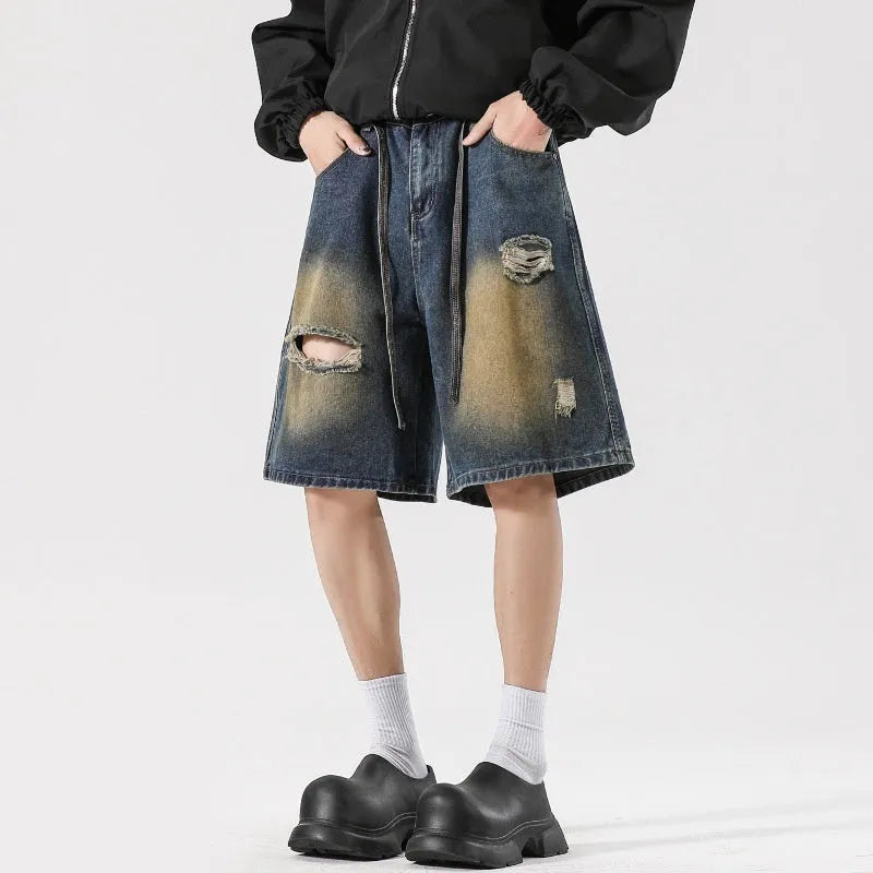 Retro blue loose fit ripped jeans with distressed detailing and cotton denim construction
