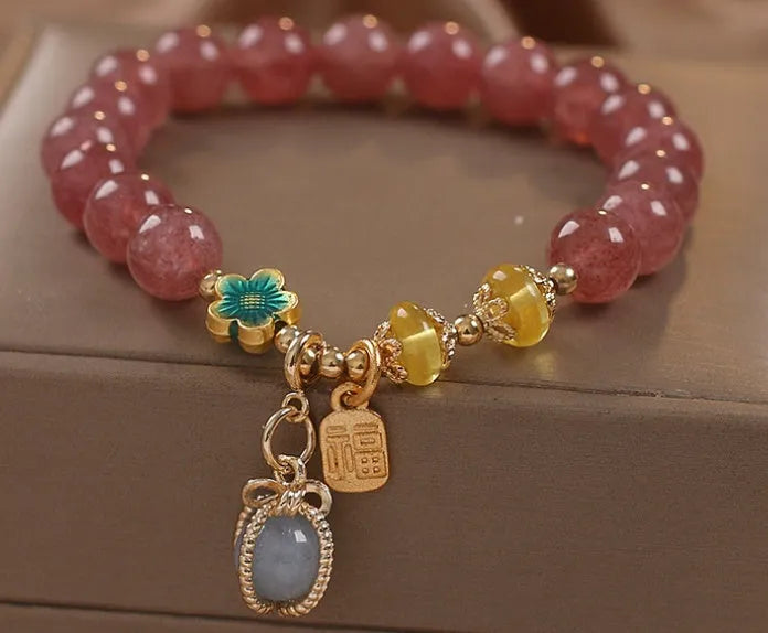 Red women's bracelet with strawberry quartz beads, alloy components, and rhinestones