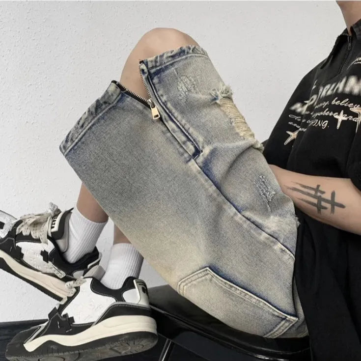 Blue retro-style denim shorts with a wide-leg loose fit and tattered detailing on a model.