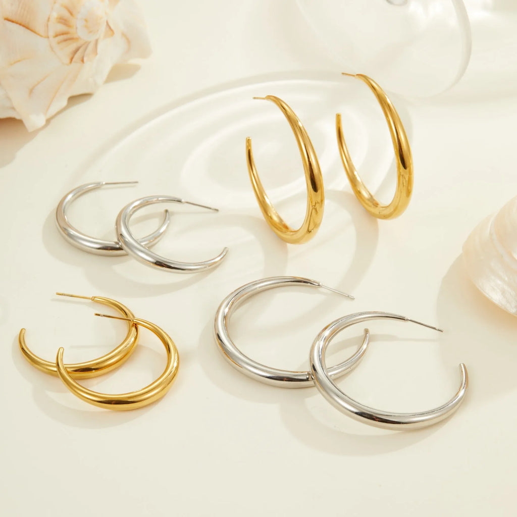 Titanium steel geometric round hoop earrings with gold plating in large and small size options