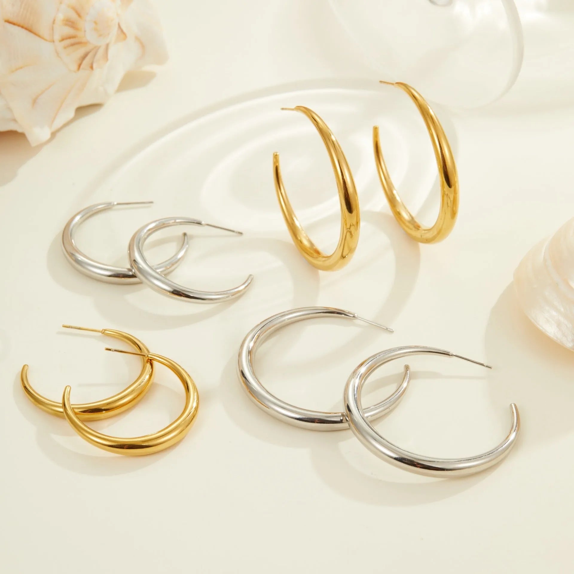Titanium steel geometric round hoop earrings with gold plating in large and small size options