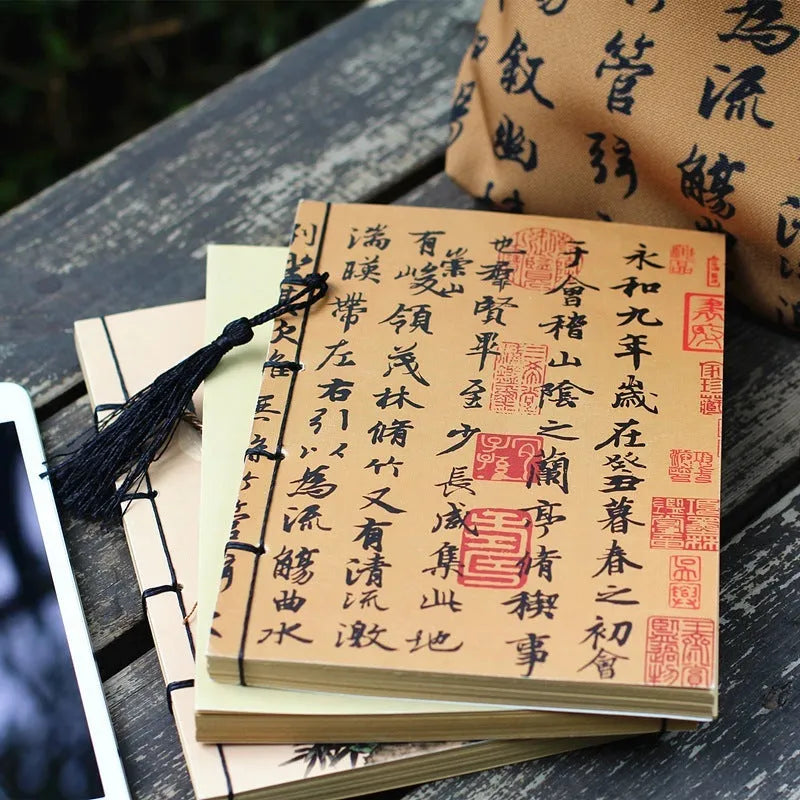 A5 antique wire-bound notebook with retro painting cover, thread binding, and black tassels.